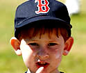 boy about 6 years old wearing Red Sox cap