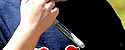 closeup, boy holding sharpie pen